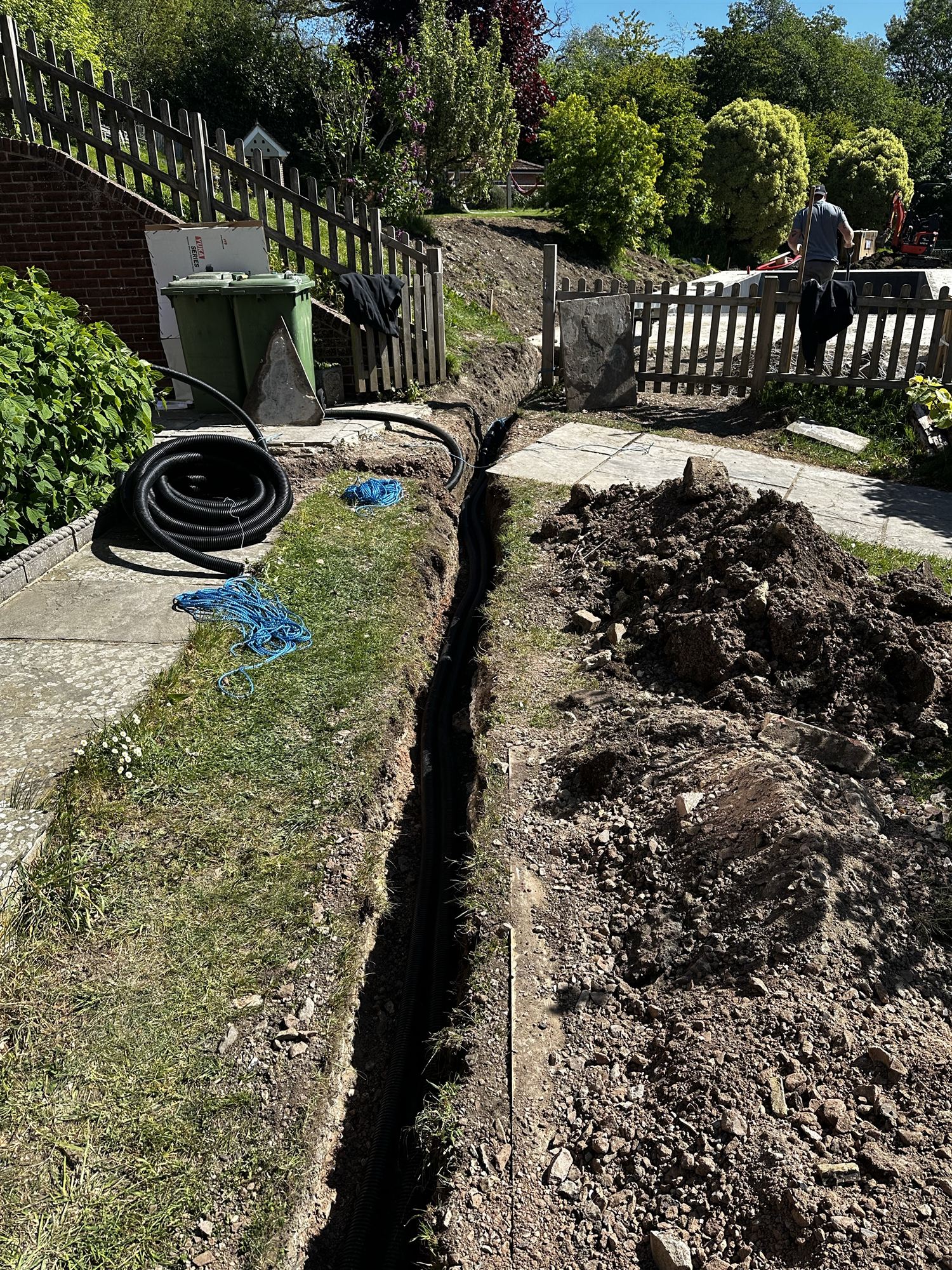 Cable trench dug alongside the path with ducting laid for electrics and future solar panels