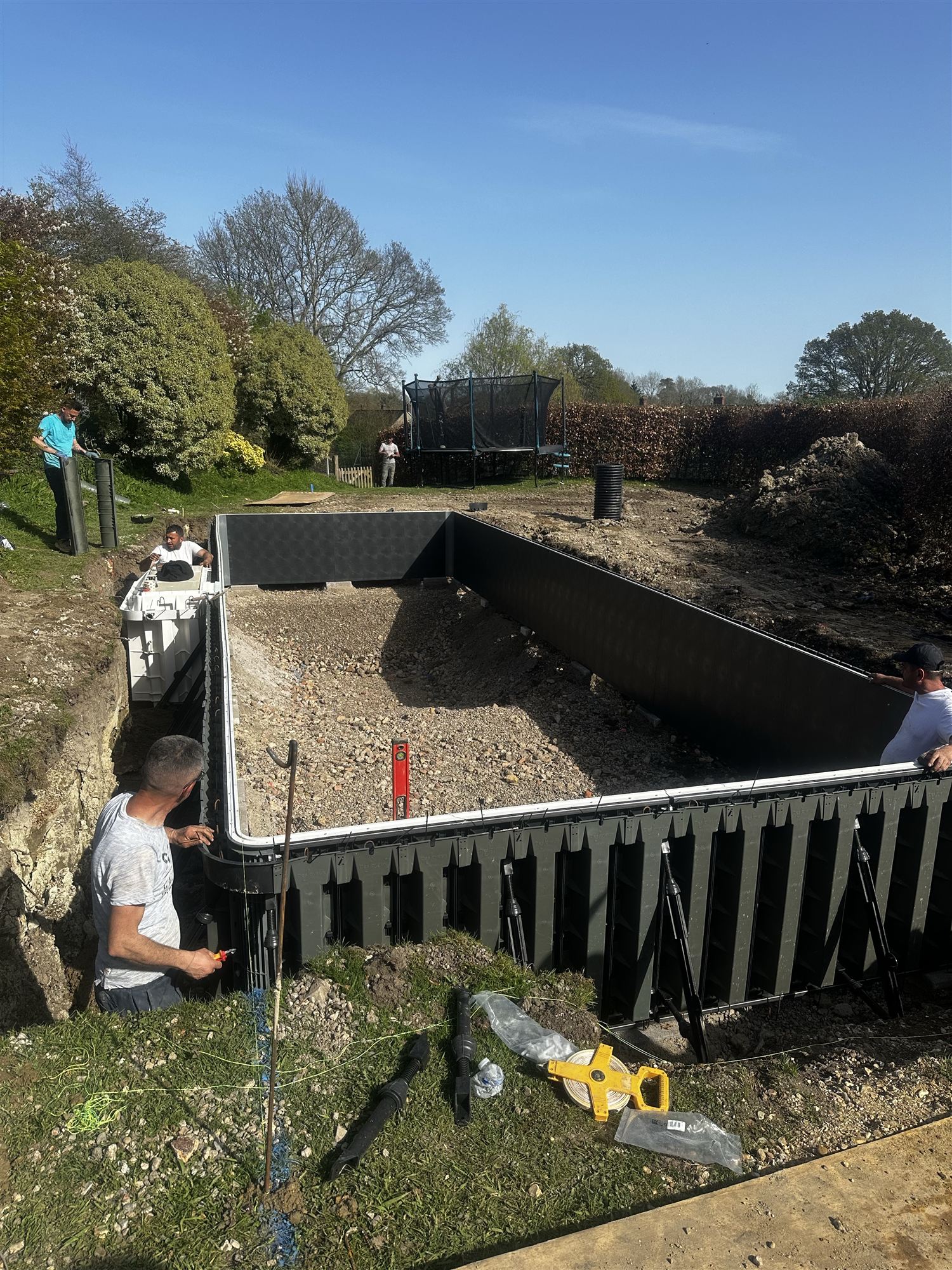 The Desjoyaux pool structure being assembled in the excavation