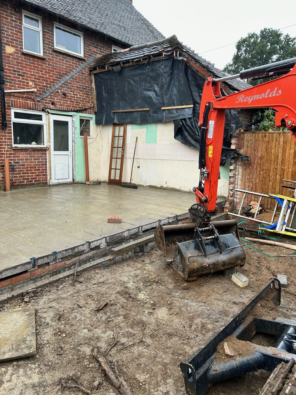 Reynolds excavator preparing groundworks for a house extension