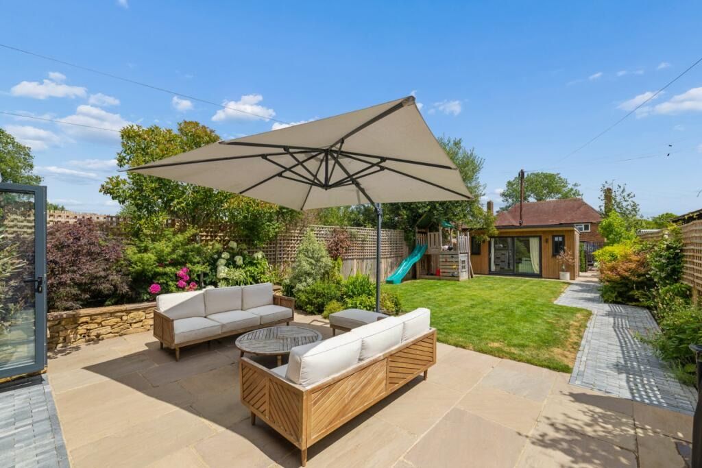 Complete garden transformation with paved terrace, outdoor seating and new lawn