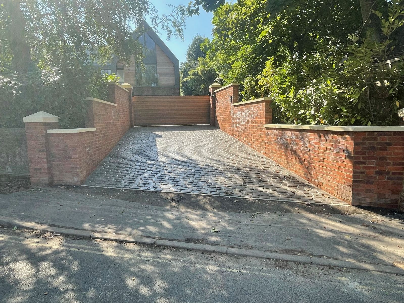 Cobbled driveway with brick piers and new electric gates